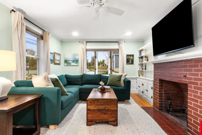 Living room with sectional couch for ample seating and smart TV with the ability to login to your streaming services