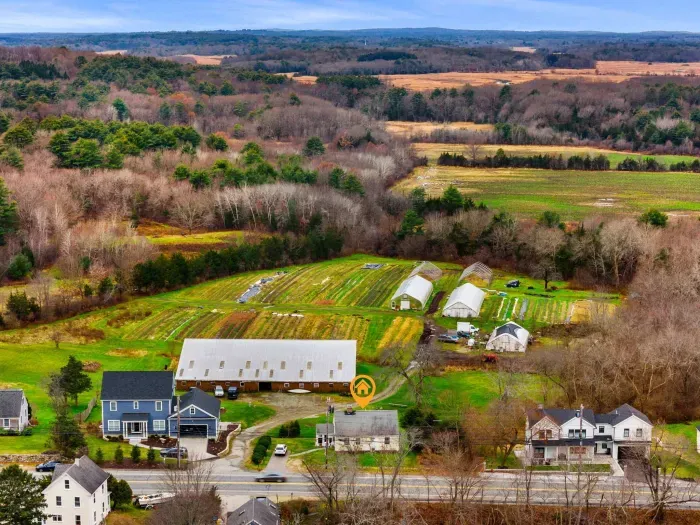 Aerial view, home overlooking the private organic produce farm