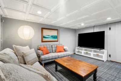 Large basement living room with TV