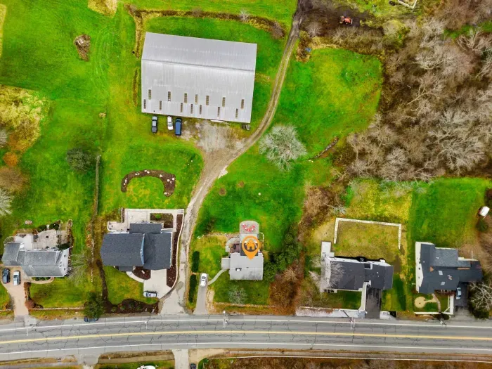 Aerial view, home overlooking the private organic produce farm