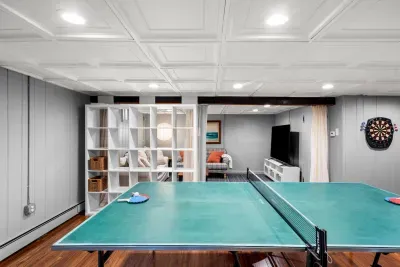 Basement ping pong table and dartboard for entertainment