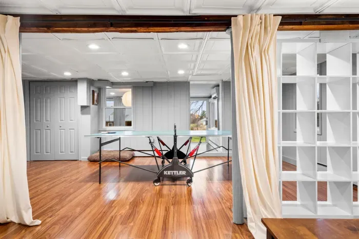 Basement ping pong table and dartboard for entertainment