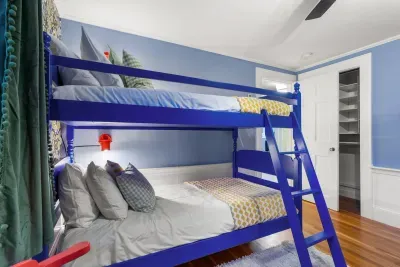 Bedroom #3 featuring 4 twin beds - twin-over-twin bunk bed and twin bed with rolling trundle beneath