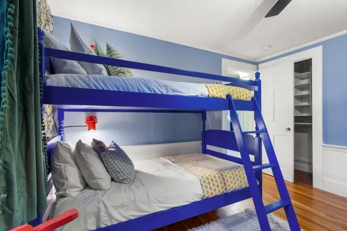 Bedroom #3 featuring 4 twin beds - twin-over-twin bunk bed and twin bed with rolling trundle beneath