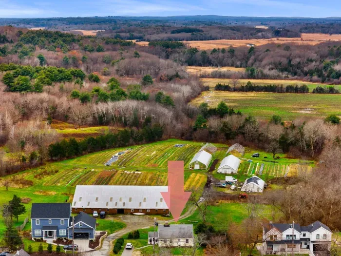 Aerial view, home overlooking the private organic produce farm