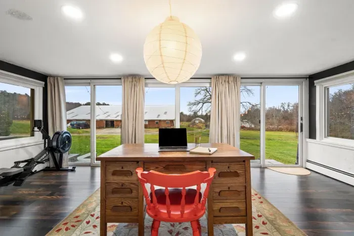 Work-from-home desk for productivity looking out over the organic farm