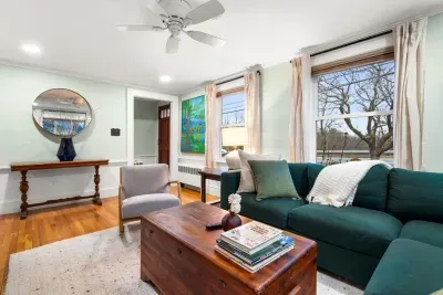 Living room with sectional couch for ample seating and smart TV with the ability to login to your streaming services