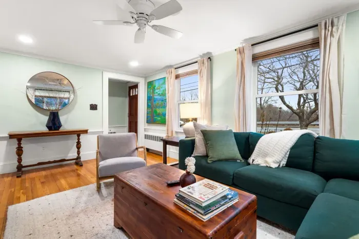 Living room with sectional couch for ample seating and smart TV with the ability to login to your streaming services