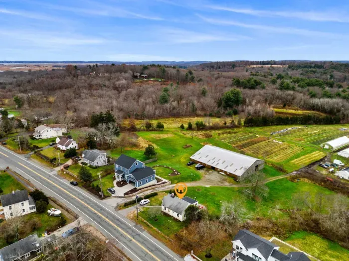 Aerial view, home overlooking the private organic produce farm