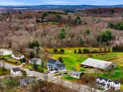Aerial view, home overlooking the private organic produce farm