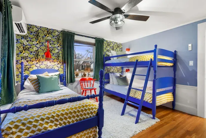 Bedroom #3 featuring 4 twin beds - twin-over-twin bunk bed and twin bed with rolling trundle beneath