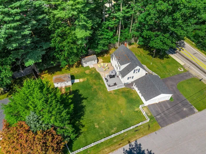 An aerial view showcasing the neighborhood's close proximity to local establishments while offering the privacy and security you desire.