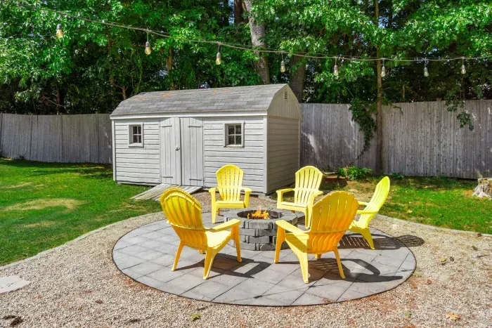 Cozy firepit seating for five—perfect for unwinding and sharing stories under the stars. 🌟🔥