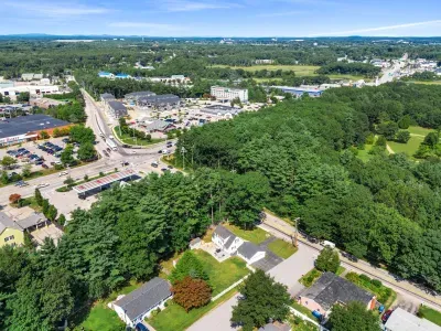 An aerial view showcasing the neighborhood's close proximity to local establishments while offering the privacy and security you desire.