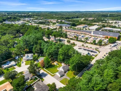 An aerial view showcasing the neighborhood's close proximity to local establishments while offering the privacy and security you desire.