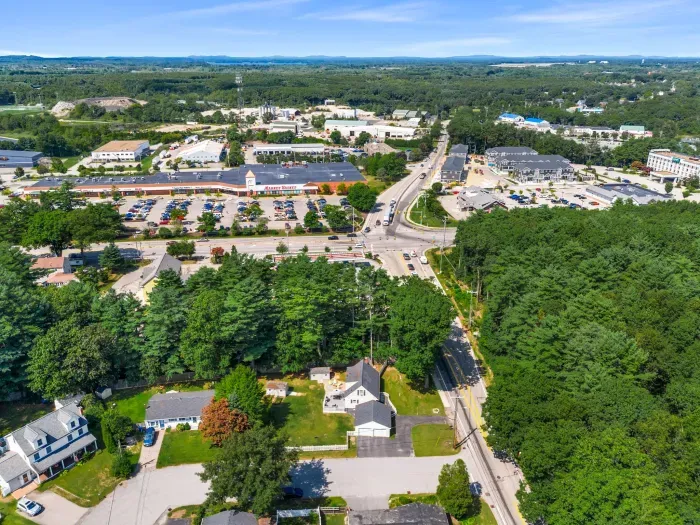 An aerial view showcasing the neighborhood's close proximity to local establishments while offering the privacy and security you desire.