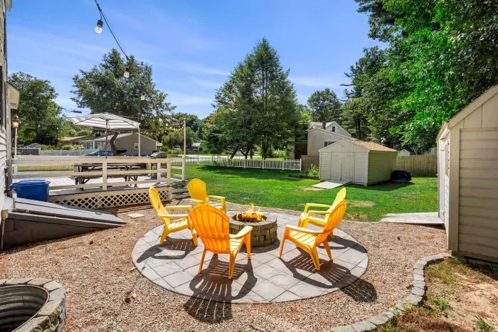 Cozy firepit seating for five—perfect for unwinding and sharing stories under the stars. 🌟🔥