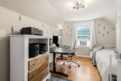 Sleep tight and work smart—your cozy queen bed and standing desk await! 😴💻 (Laptop is for display purposes)