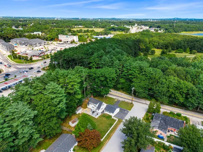 An aerial view showcasing the neighborhood's close proximity to local establishments while offering the privacy and security you desire.