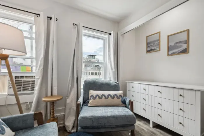 Bedroom #3 with king bed, smart TV, and cozy reading nook
