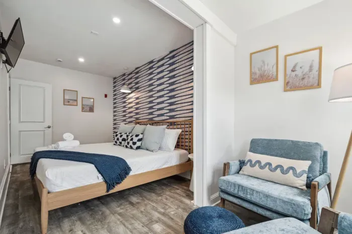 Bedroom #3 with king bed, smart TV, and cozy reading nook