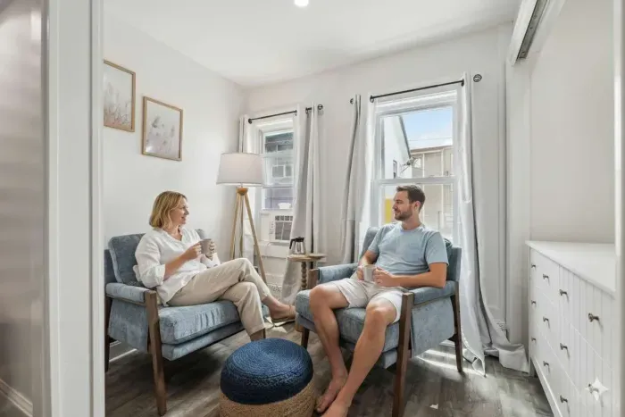 Bedroom #3 with king bed, smart TV, and cozy reading nook