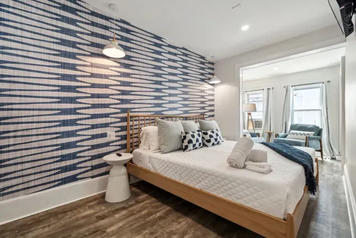 Bedroom #3 with king bed, smart TV, and cozy reading nook