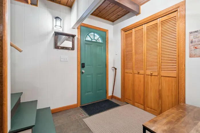 The downstairs entry area. The washer and dryer are located in the closet.