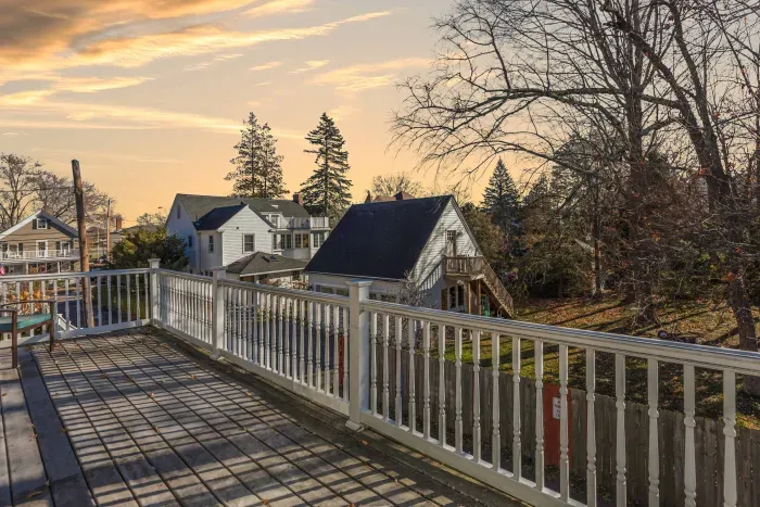 Large balcony off the living room perfect for enjoying morning coffee! There Adirondack chairs  available during the summer months
