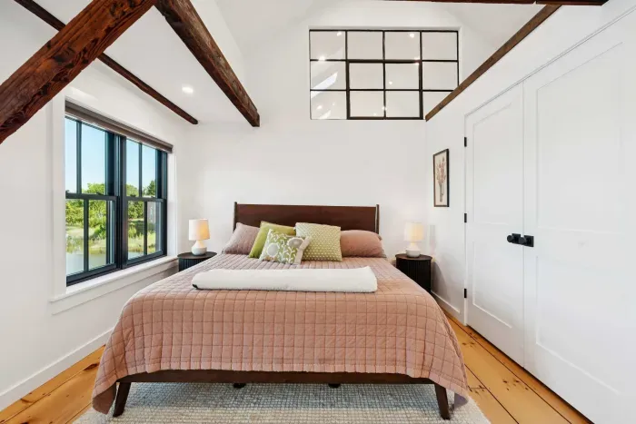 Master bedroom with California King bed and stunning views of the Squamscott River. There is a large full sized closet. Clean linens are provided.