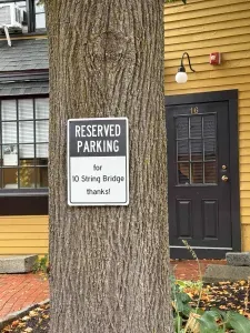 One (1) designated parking space for the unit.