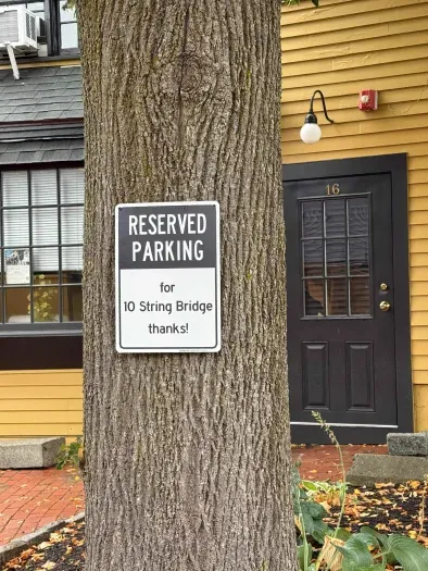 One (1) designated parking space for the unit.