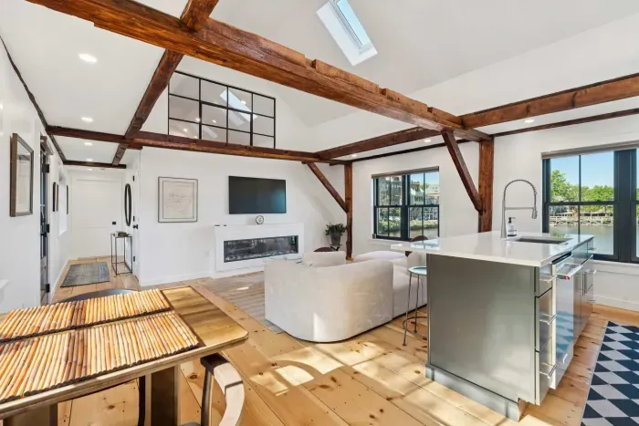 Open concept kitchen and living are with vaulted ceilings and high end finishes. Featuring stunning river views.