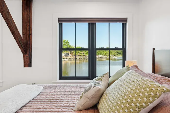 Master bedroom with California King bed and stunning views of the Squamscott River. There is a large full sized closet. Clean linens are provided.
