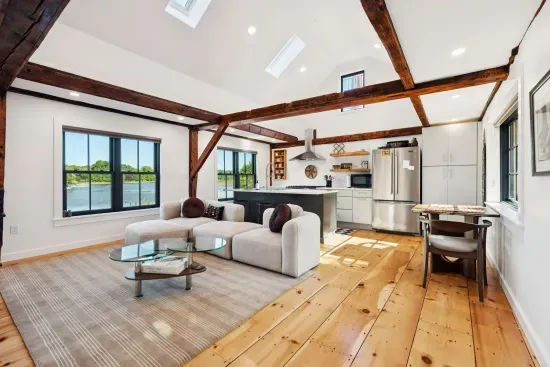 Open concept kitchen and living are with vaulted ceilings and high end finishes. Featuring stunning river views.