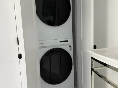 Full size washer and dryer located in the bathroom.