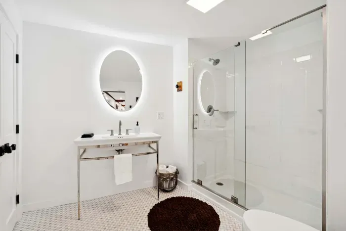 Full Bathroom with glass standing shower. Washer and dryer are located in this room. Clean towels, and shampoo/body wash are provided.