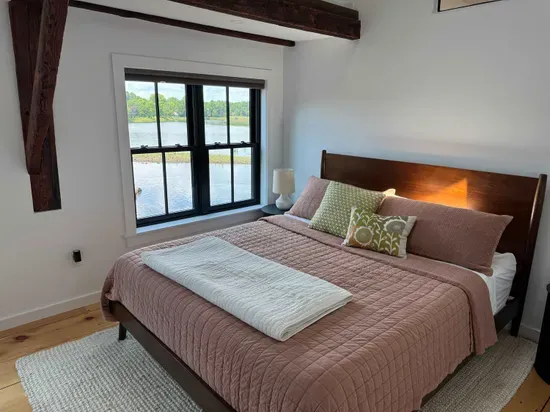 Master bedroom with California King bed and stunning views of the Squamscott River