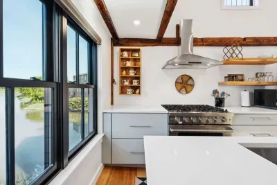 Open concept kitchen and living are with vaulted ceilings and high end finishes. Featuring stunning river views.