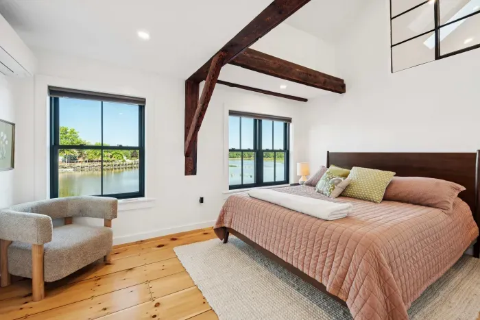Master bedroom with California King bed and stunning views of the Squamscott River. There is a large full sized closet. Clean linens are provided.