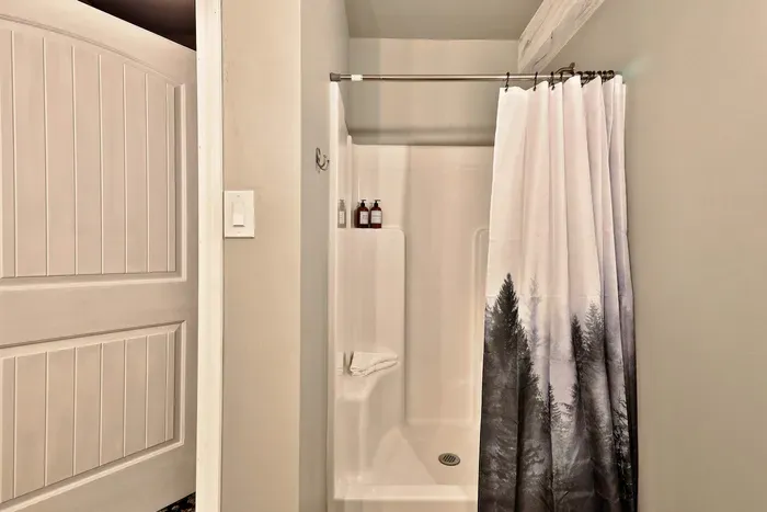Standing shower includes shampoo and body wash and complimentary towels.
