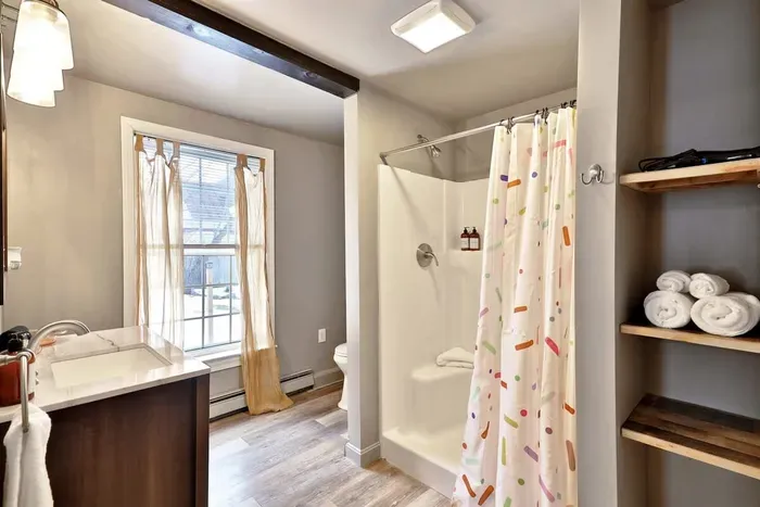 Ben & Jerry - Standing shower includes shampoo and body wash and complimentary towels.