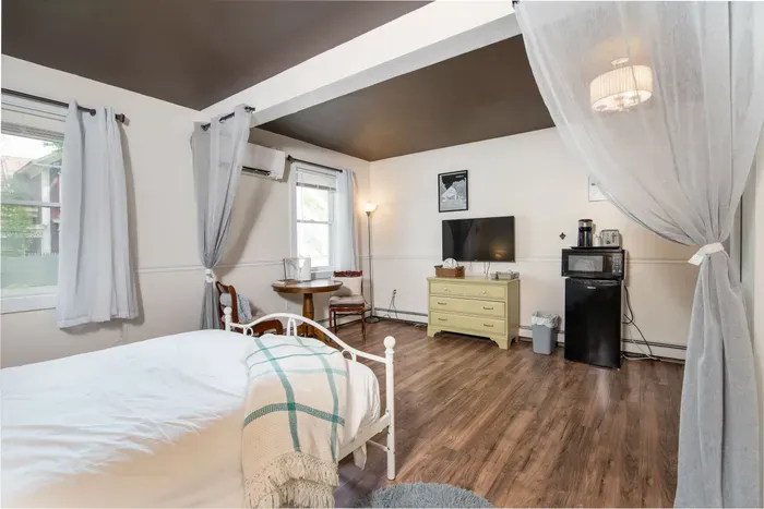 The Bridgewater Inn Main House - Featuring a Dedicated Dining Table, Microwave, & Mini-Fridge