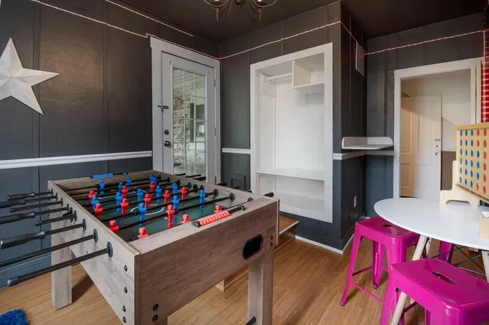The Bridgewater Inn Main House- The Game Room, with ping pong, lots of games, another Roku TV and foosball in the adjacent room.