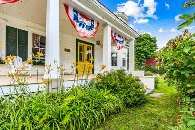 The iconic front porch is a great place to soak up some summer sun!