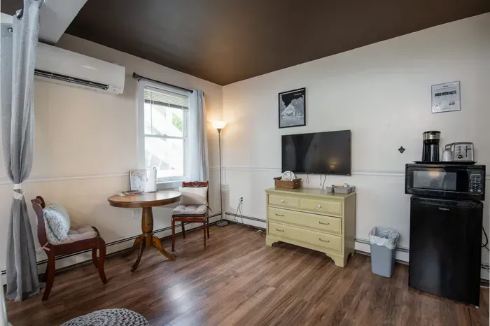 The Bridgewater Inn Main House - Featuring a Dedicated Dining Table, Microwave, & Mini-Fridge