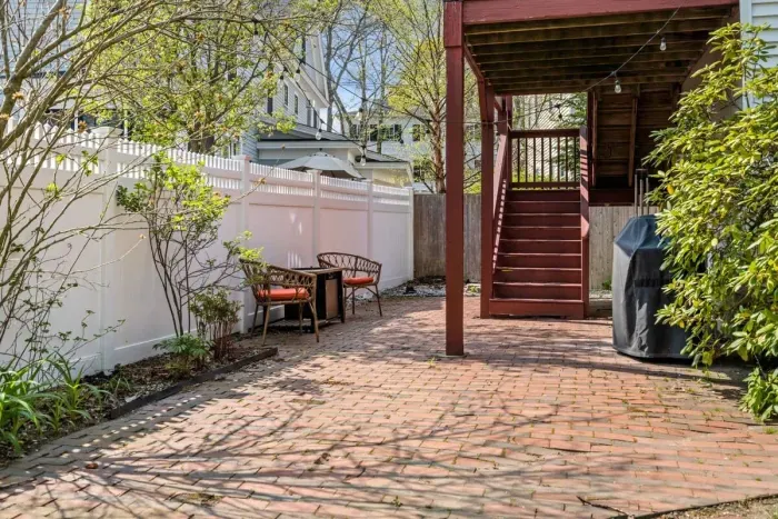 Back paved patio with lounge chairs and gas grill. Please note: We are in the process of upgrading our patio furniture. The patio will soon feature an outdoor table and chairs, perfect for outdoor meals and relaxation