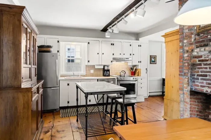 fully equipped kitchen with dining room table and all major appliances.