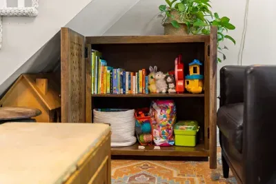 Game cabinet, located in the first level living room.