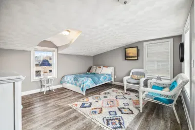 The queen bedroom located on the third floor! Access to the rooftop deck is located here. Please note there is not door to this bedroom but is the only room on this floor. Clean linens provided